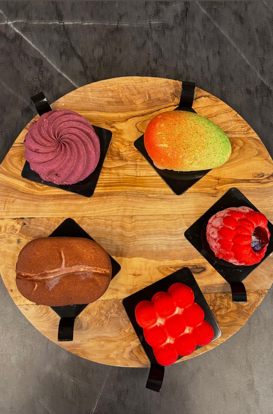 Our colorful pastry selection arranged on a wooden serving board